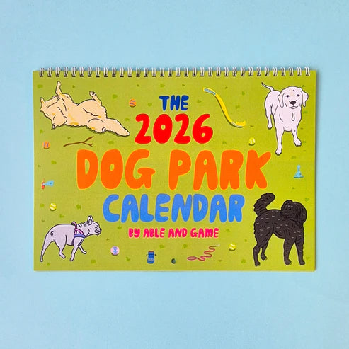 2026 Dog Park Calendar with colorful illustrations of dogs on a light blue background