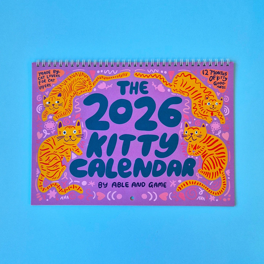 2026 Kitty Calendar with colorful cat illustrations on a blue background
