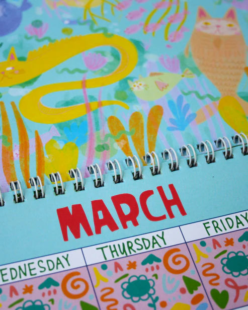 Colorful calendar with illustrations of animals and the word 'March' on a blue background.