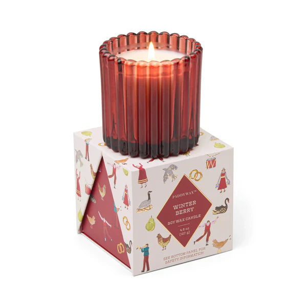 Red candle in a decorative box with illustrations on a white background