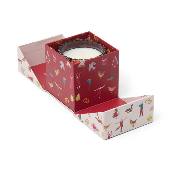 Candle in decorative box with sides that flip open