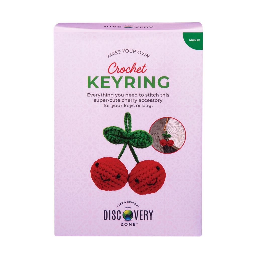 Crochet keyring kit packaging with cherry design on a white background