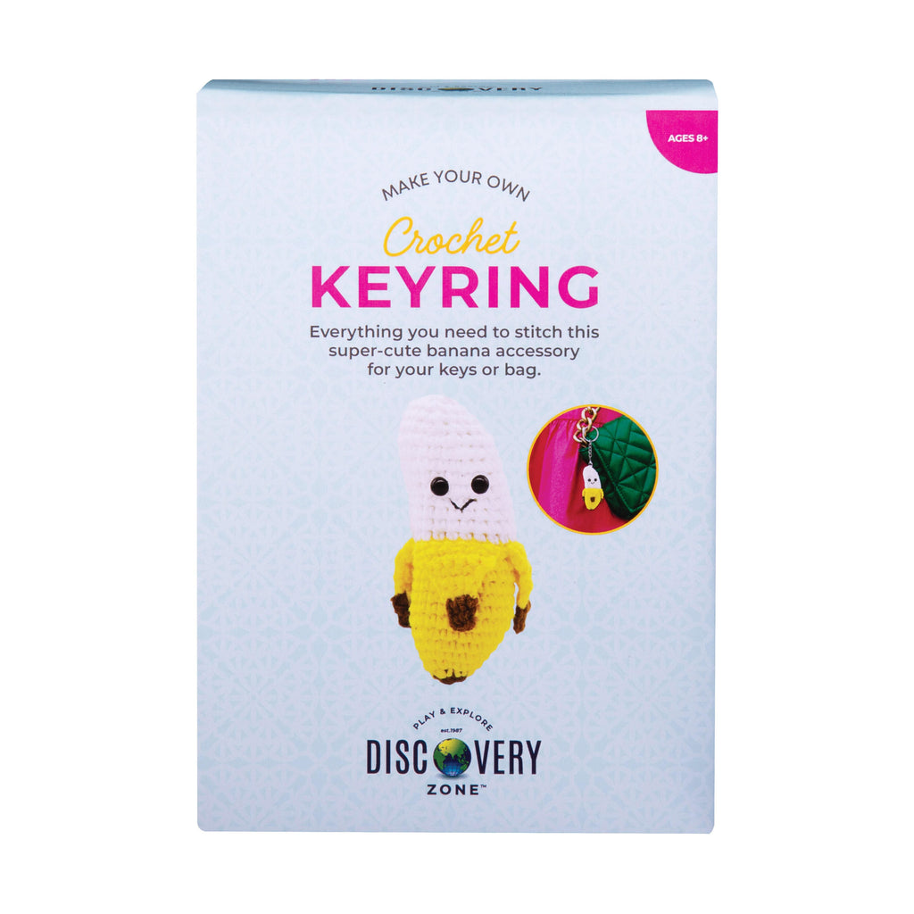 Crochet keyring kit packaging with a banana-themed keychain on a light blue background