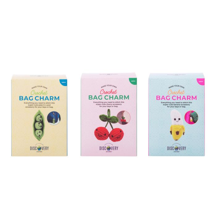 Three packages of crochet bag charms with colorful designs on a white background
