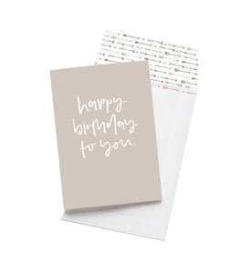 A light grey birthday card which reads "happy birthday to you" in white text by the brand Emma Kate Co. 