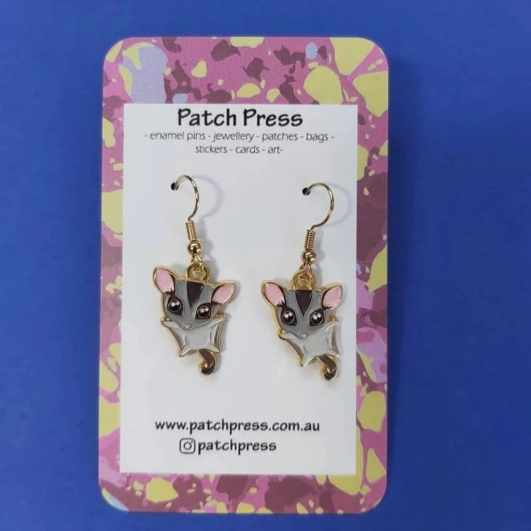 Patch press sugar glider enamel dangle earrings at HYMC in Adelaide, South Australia.