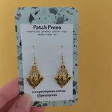 Patch press yellow protea enamel dangle earrings at HYMC in Adelaide, South Australia.