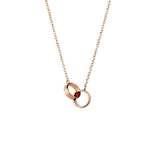 a simple sterling silver rose gold plated necklace with two entwining circle pendant have you met charlie adelaide australia unique gift shop