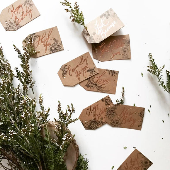 These floral gift tags are the perfect finishing touch. They feature botanical illustration design and rose gold foil calligraphy printed beautifully on thick 350gsm brown stock from have you met charlie unique gift shop in adelaide south australia
